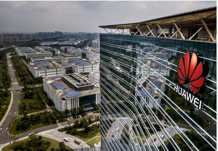 The Huawei logo is seen on the side of the main building at the company’s production campus on April 25, 2019 in Dongguan, near Shenzhen, China.